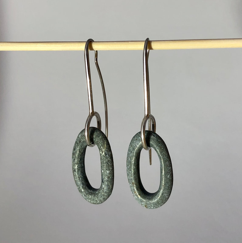 These Earrings are made from Sterling Silver and Pebbles that have been drilled and carved to create light weight loops