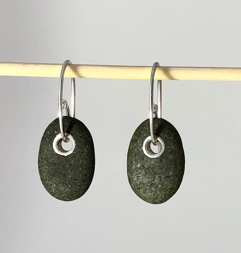 These popular little drop Earrings are made from Sterling Silver and Greywacke Pebbles. Maike collected the pebbles on Birdlings Flat beach on the South Island of New Zealand.